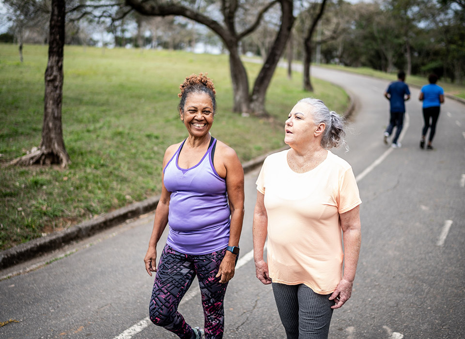 senior-women-walking-park-banner senior-women-walking-park-banner